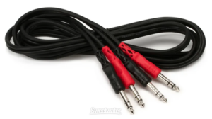 Box of 1/4 inch audio cables and adapters